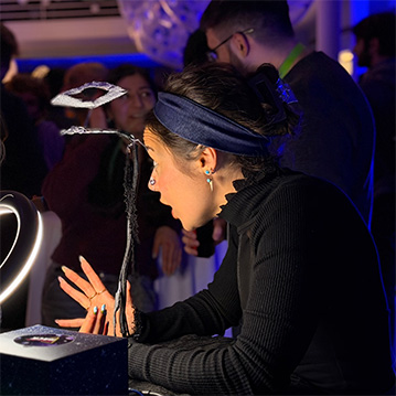 indigo coiyle digital medium doing a palm reading